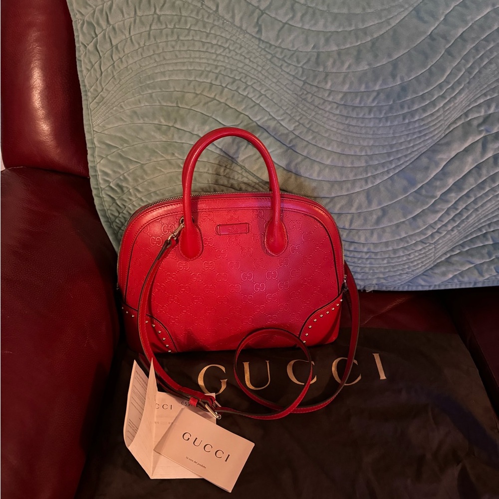 RED Gucci Hillary Lux GG Monogram Embossed sudded top handle with straps.